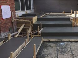3-patriarch-construction-calgary-concrete-contractors-willowfern-patio-staircase-during-3