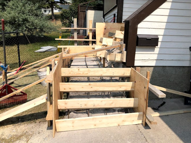 8-patriarch-construction-calgary-concrete-contractors-edgemont-stairs-staircase-brushed-breakout-during-1